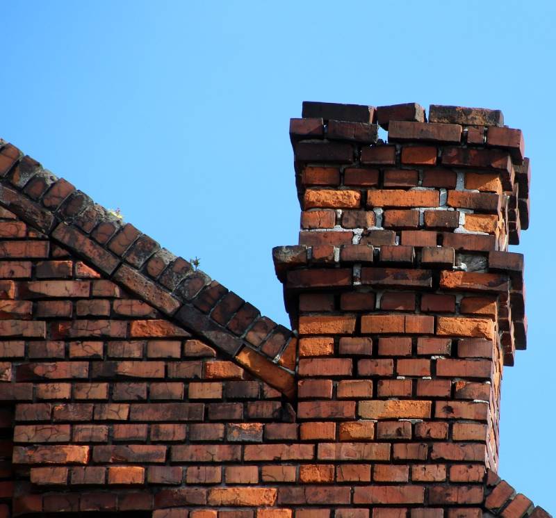 Signs Your Crowley Home Needs a Chimney Inspection Damaged chimney on an Crowley home showing cracks and missing mortar
